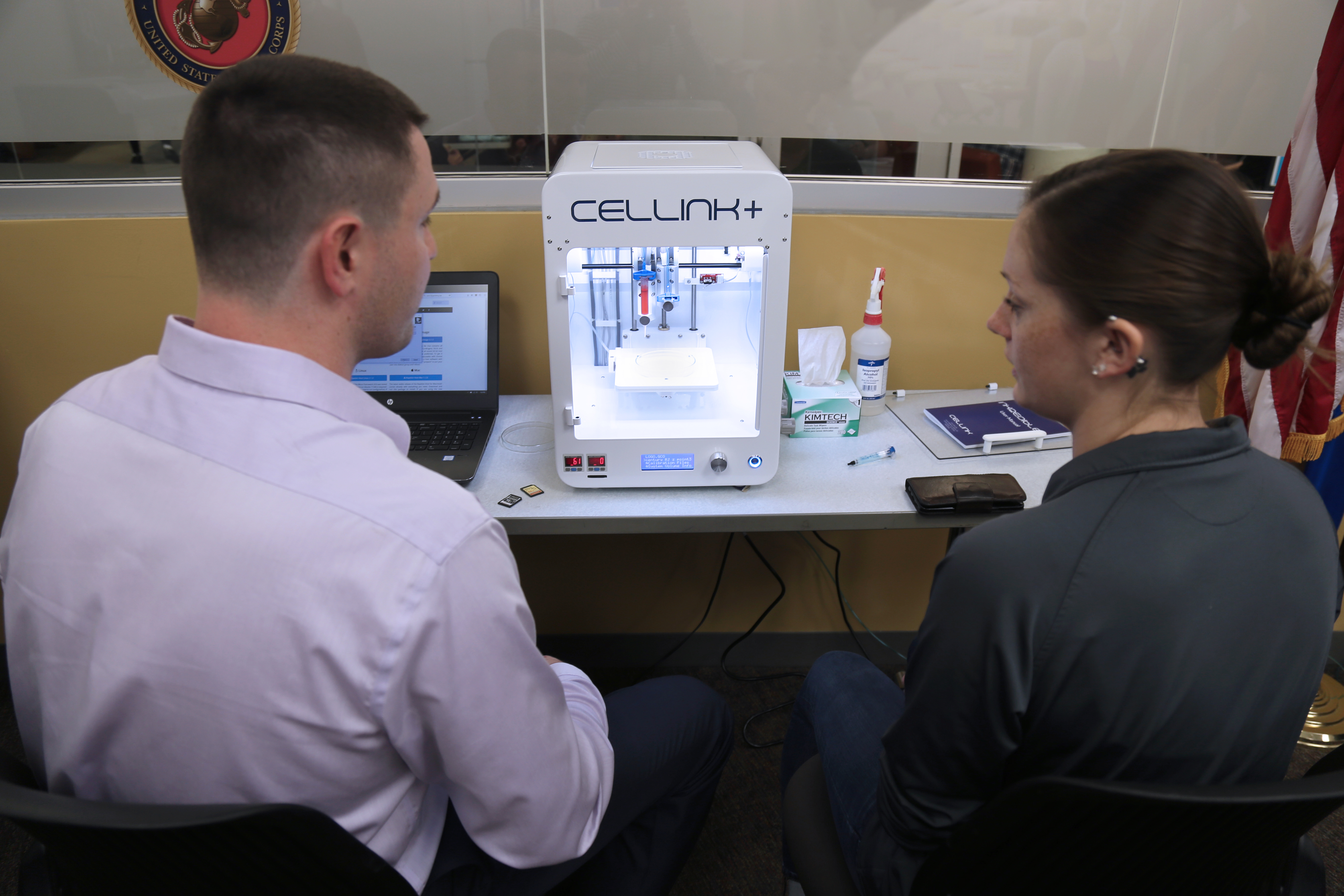Two students facing Cellink Plus machine